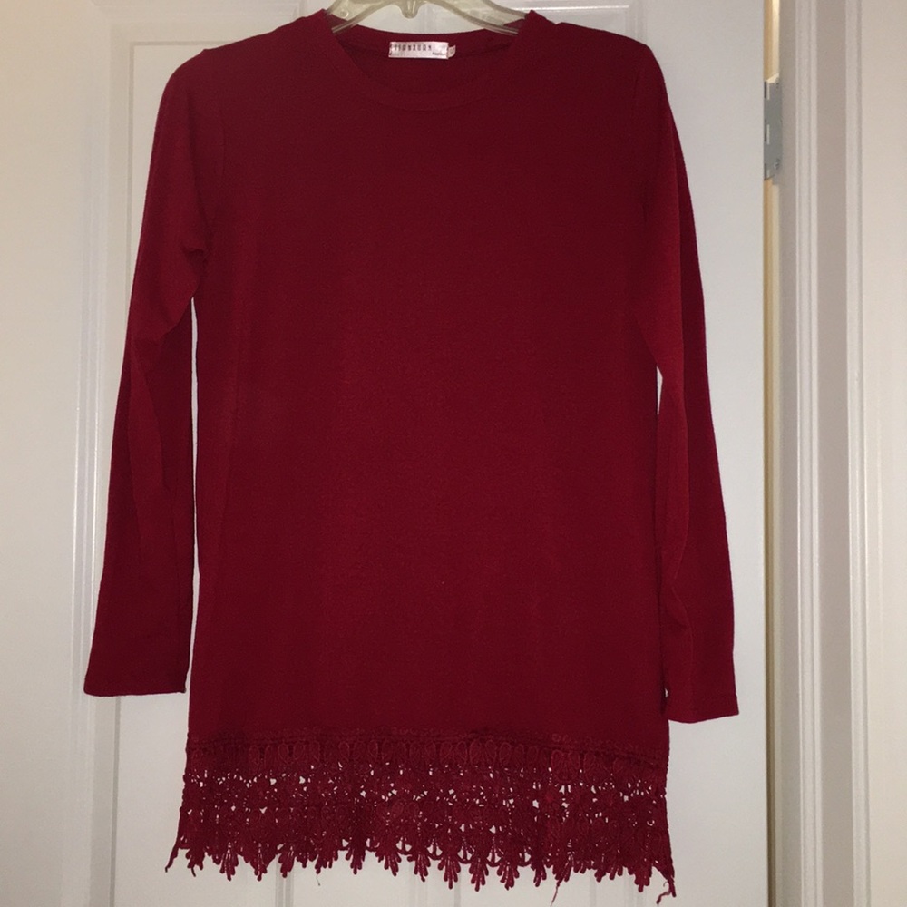Red long sleeved shirt with bottom detailing